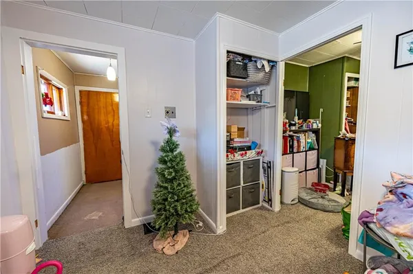 a view of room with window and entryway