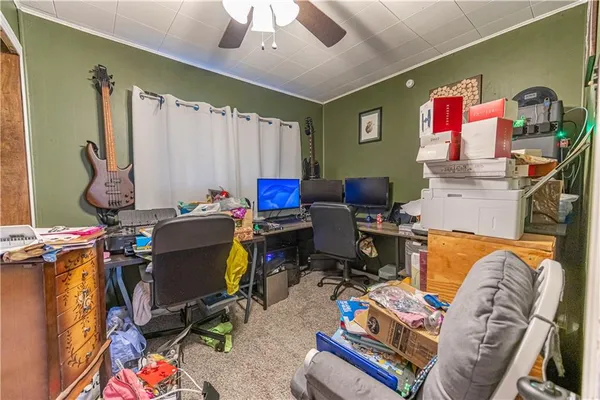 a living room with furniture a air conditioner and a chandelier