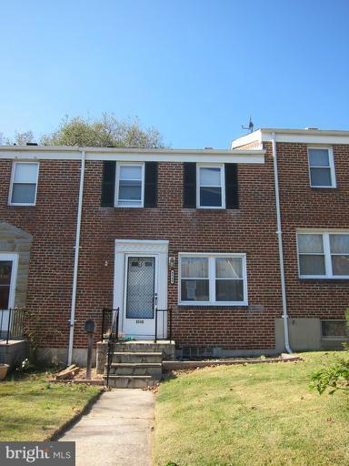 8540 Water Oak Road Baltimore, MD 21234 - Photo 1 of 12 a view of a brick house with many windows and yard