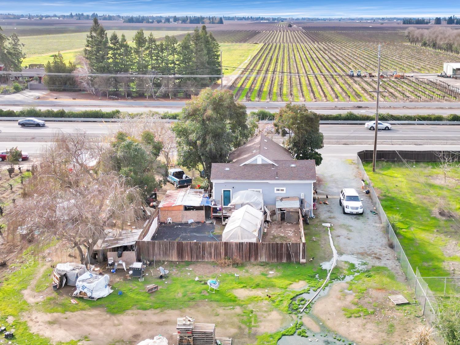 20388 Highway 99 Acampo, CA 95220 - Photo 19 of 24 a view of a house with a yard balcony and sitting area