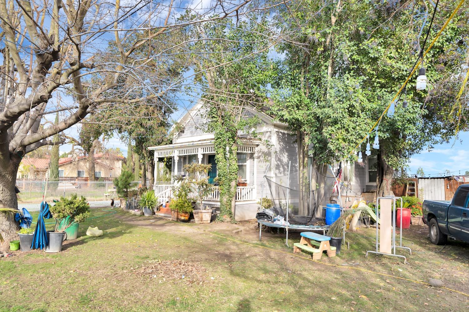 20388 Highway 99 Acampo, CA 95220 - Photo 2 of 24 a view of a park with bench and a tree
