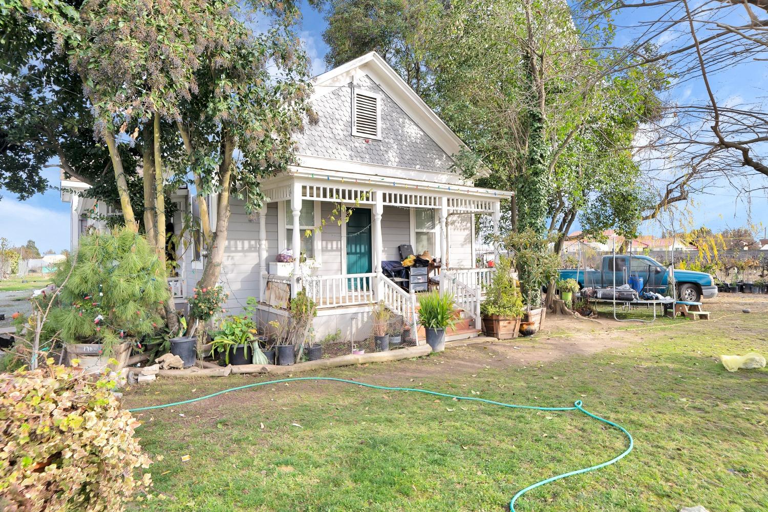 20388 Highway 99 Acampo, CA 95220 - Photo 4 of 24 a front view of a house with a yard
