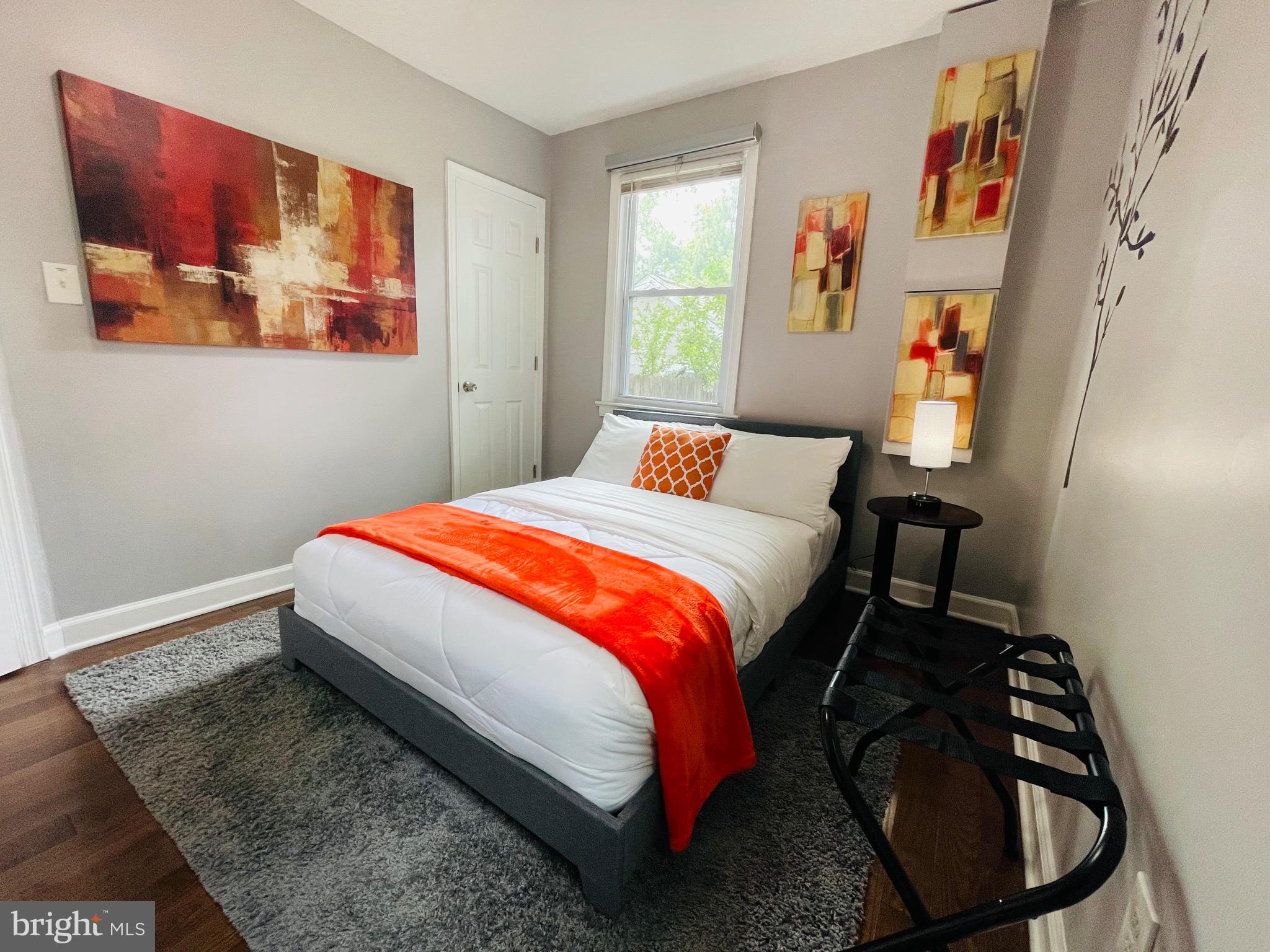 2723 Randolph Road Silver Spring, MD 20902 - Photo 11 of 33 a bedroom with a bed and a painting on the wall