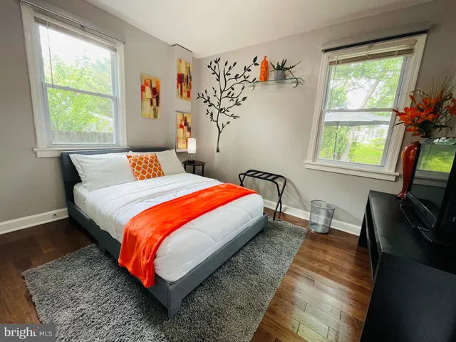 a bedroom with bed and a window