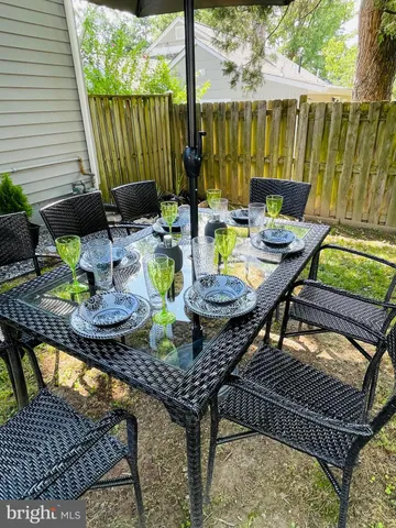 swimming pool view with a seating space