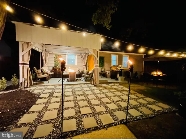 a view of a lobby with a couch and a rug