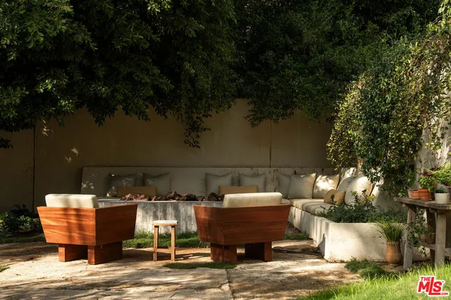 a view of backyard with seating space