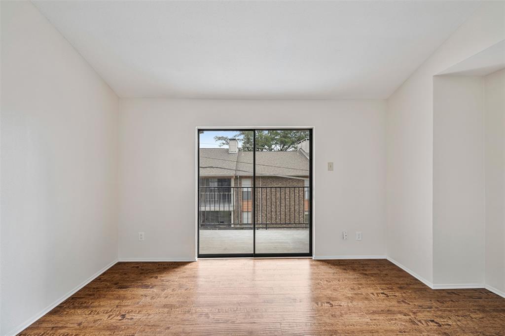 5335 Bent Tree Forest Drive, Unit 288 Dallas, TX 75248 - Photo 11 of 27 an empty room with sliding door