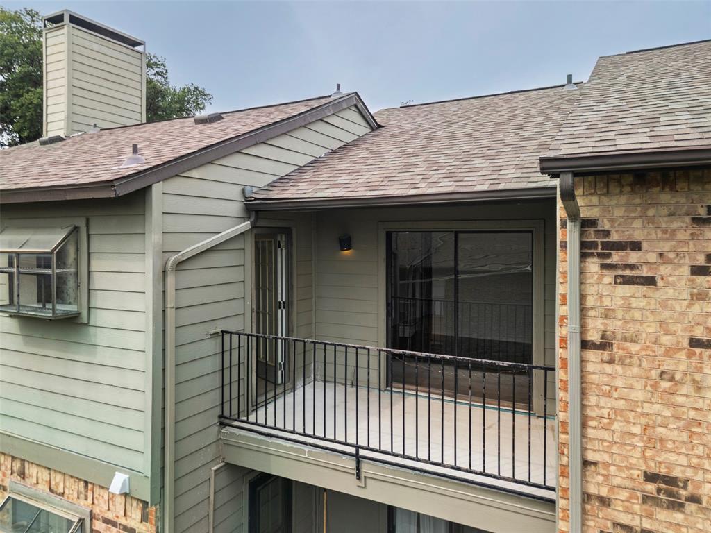 5335 Bent Tree Forest Drive, Unit 288 Dallas, TX 75248 - Photo 17 of 27 a view of a wooden house with a large window