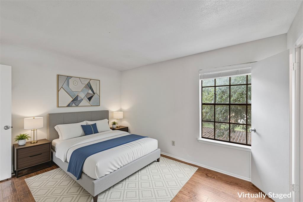 5335 Bent Tree Forest Drive, Unit 288 Dallas, TX 75248 - Photo 20 of 27 a bedroom with a bed and a window