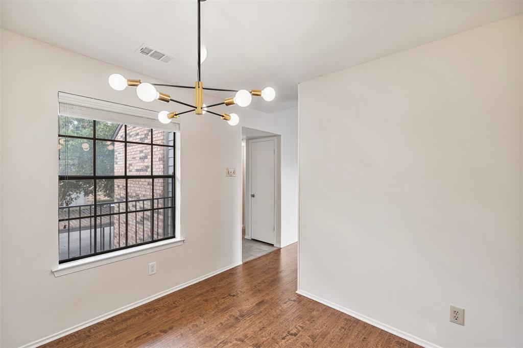 5335 Bent Tree Forest Drive, Unit 288 Dallas, TX 75248 - Photo 4 of 27 a view of a room with window and wooden floor