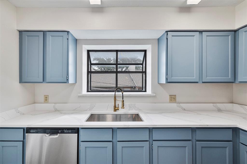 5335 Bent Tree Forest Drive, Unit 288 Dallas, TX 75248 - Photo 6 of 27 a kitchen with a sink and cabinets