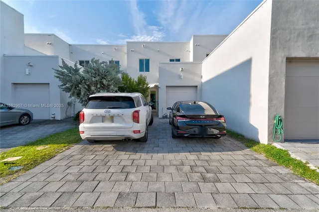 a view of a house with porch and a bench
