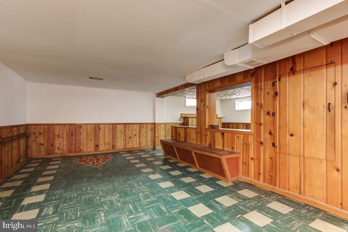 11911 Rocking Horse Road Rockville, MD 20852 - Photo 21 of 27 Basement w/ shuffle board game in tiles.
