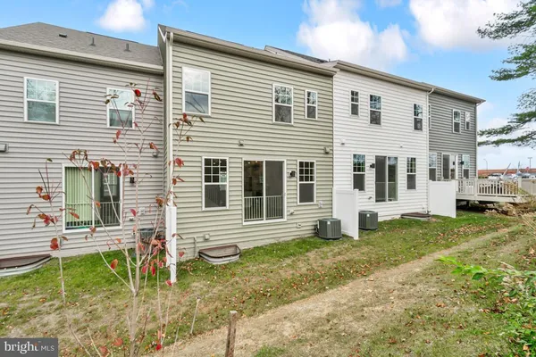 a view of house with backyard