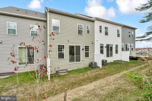a view of house with backyard