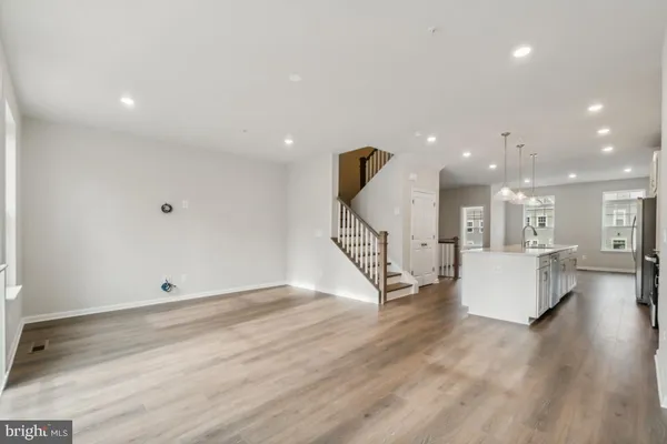 a view of an empty room and wooden floor