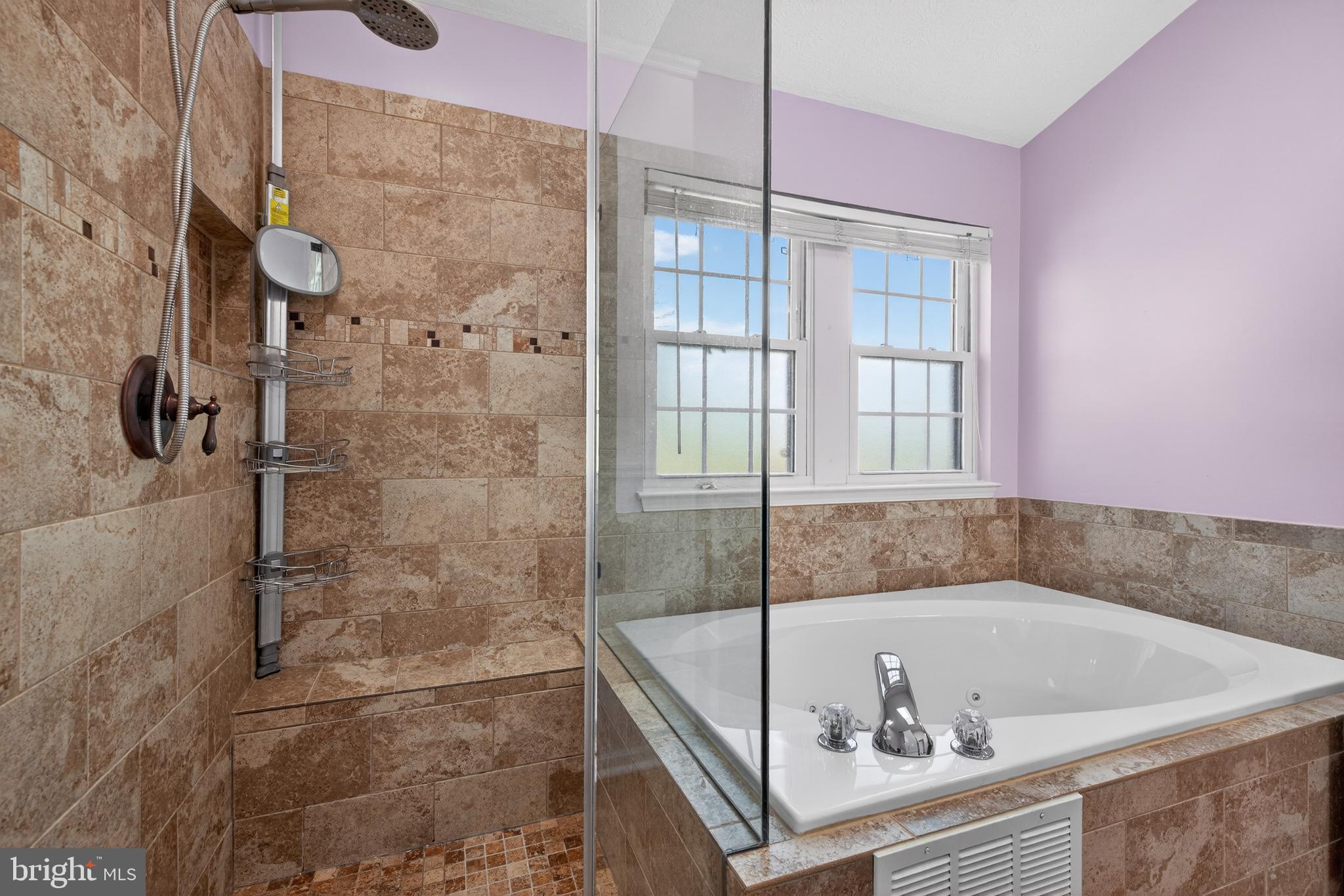 611 Hunting Ridge Drive Frederick, MD 21703 - Photo 39 of 50 a bathroom with a bathtub and shower