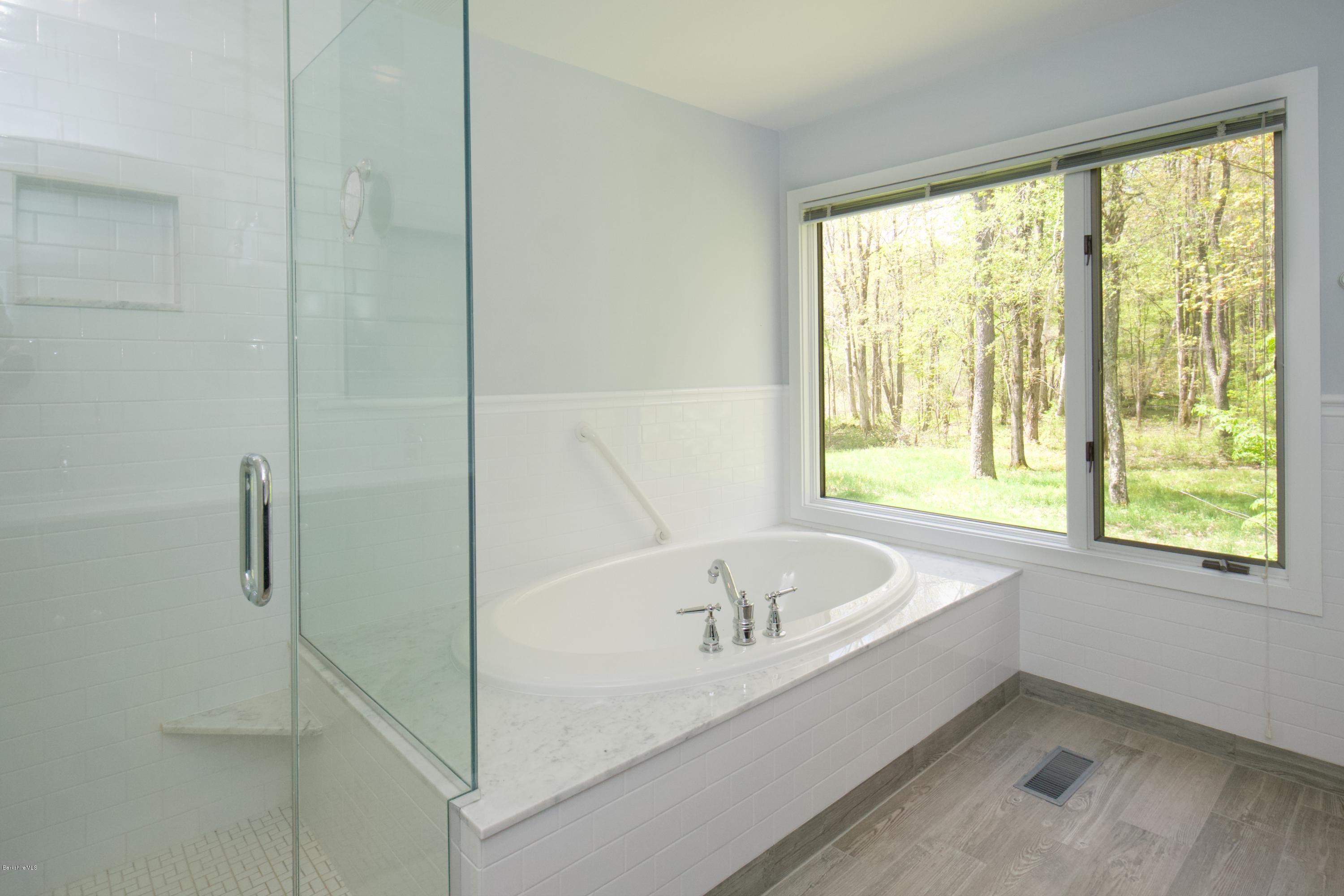 8 Austerlitz Road West Stockbridge, MA 01266 - Photo 13 of 24 a white bath tub sitting next to a window