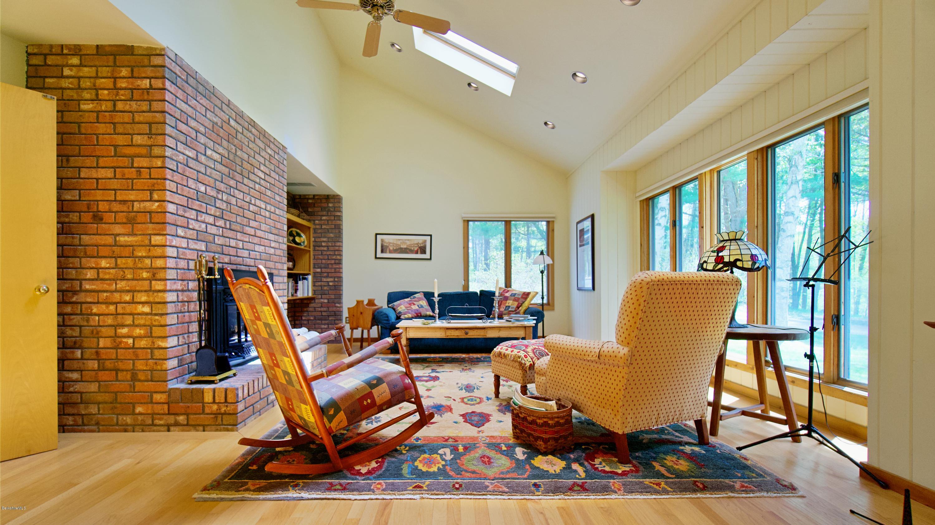 8 Austerlitz Road West Stockbridge, MA 01266 - Photo 3 of 24 a living room filled with furniture a rug and a large window
