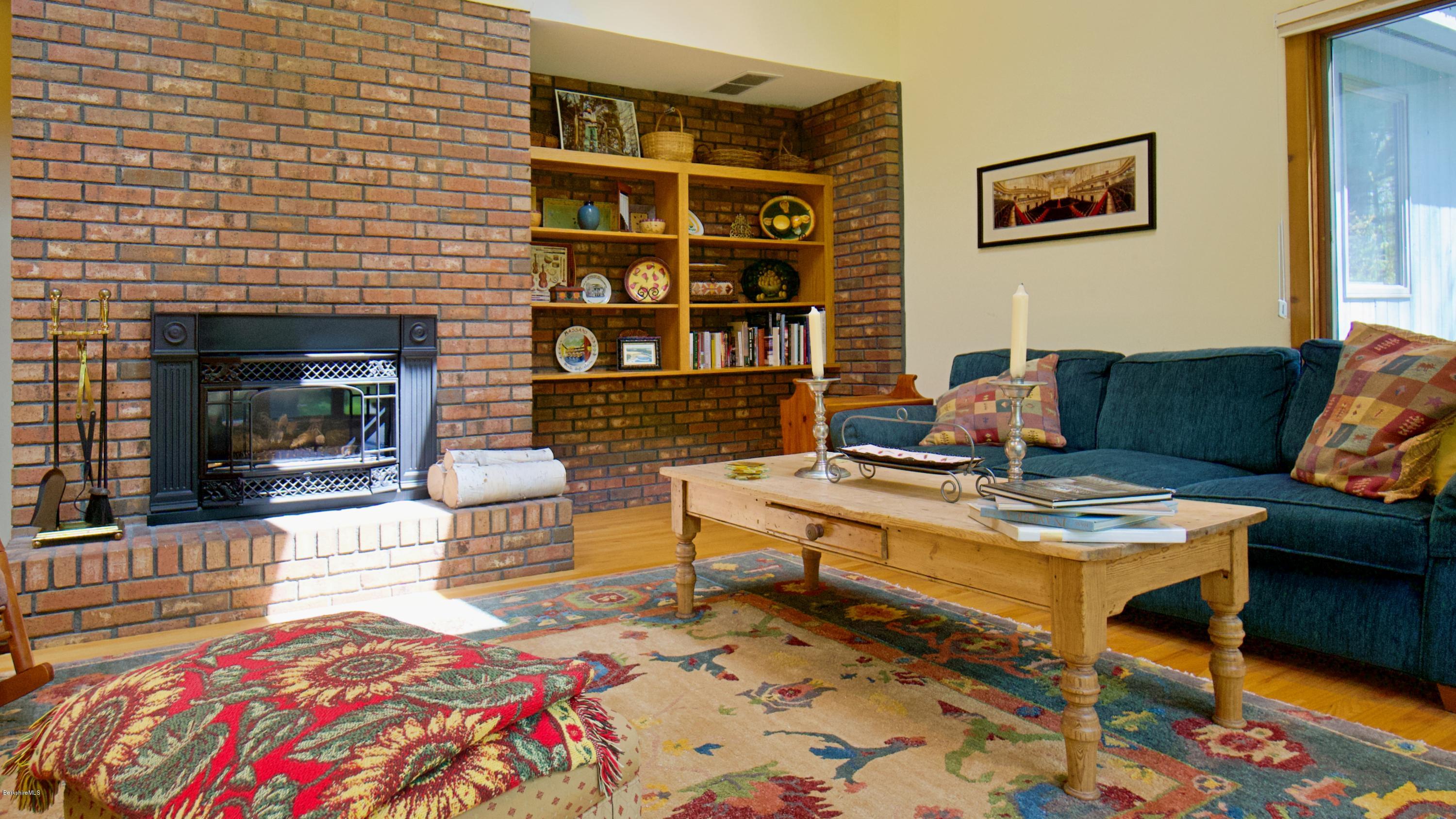 8 Austerlitz Road West Stockbridge, MA 01266 - Photo 4 of 24 a living room with furniture and a fireplace