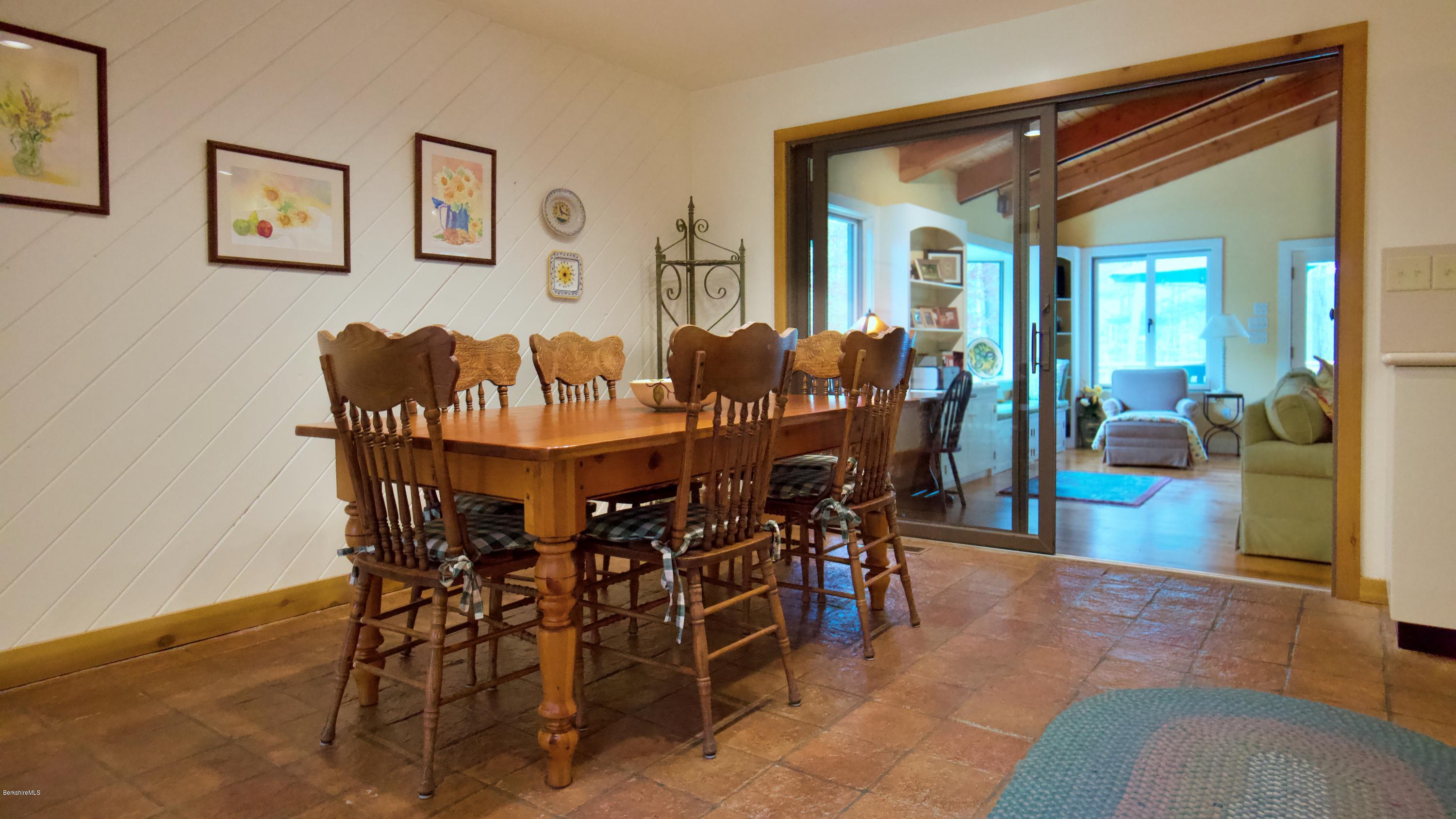 8 Austerlitz Road West Stockbridge, MA 01266 - Photo 7 of 24 a view of a dining room and livingroom with furniture wooden floor a rug and a painting