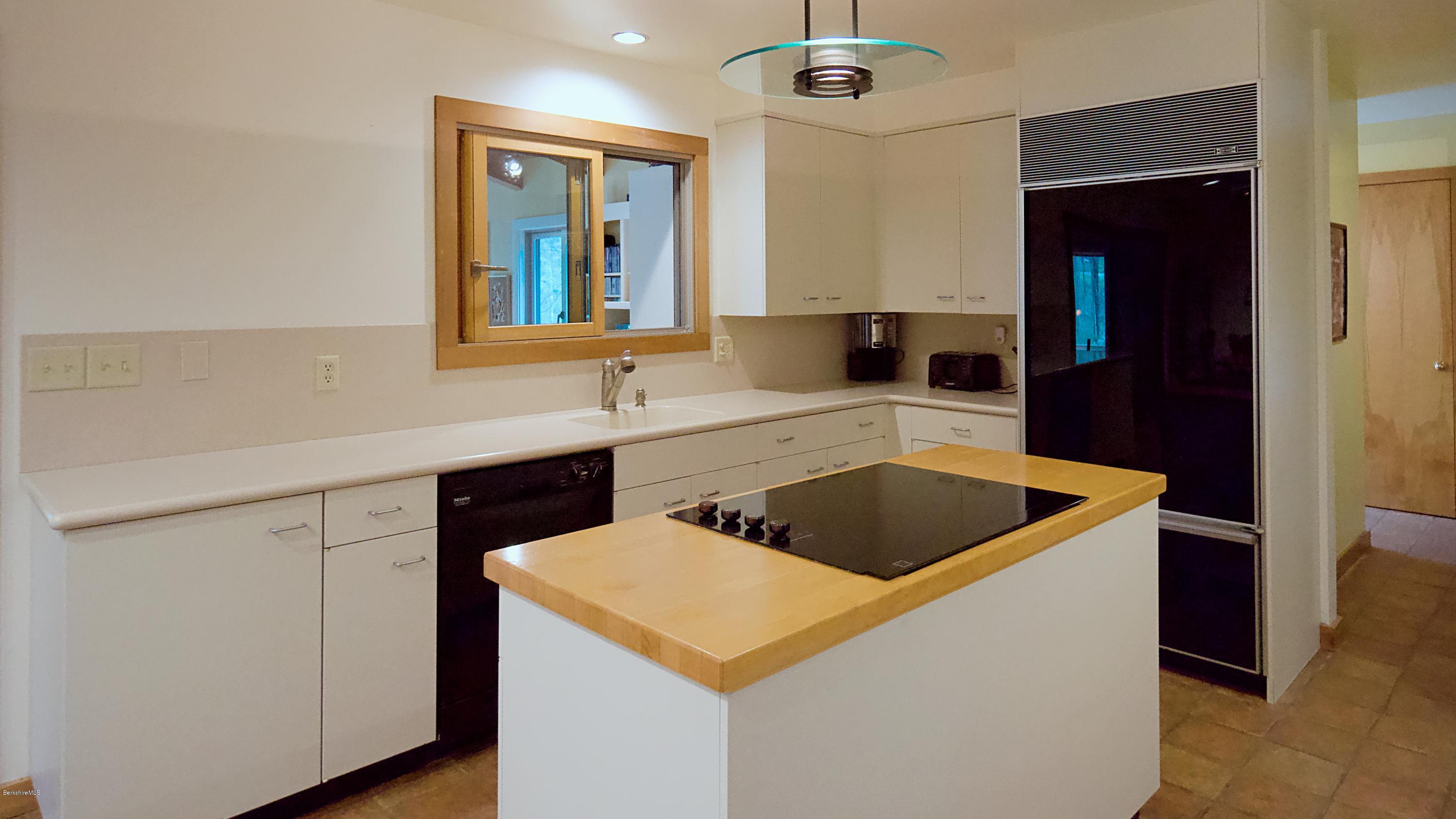 8 Austerlitz Road West Stockbridge, MA 01266 - Photo 9 of 24 a kitchen with a sink a stove and cabinets
