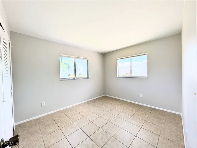 an empty room with windows