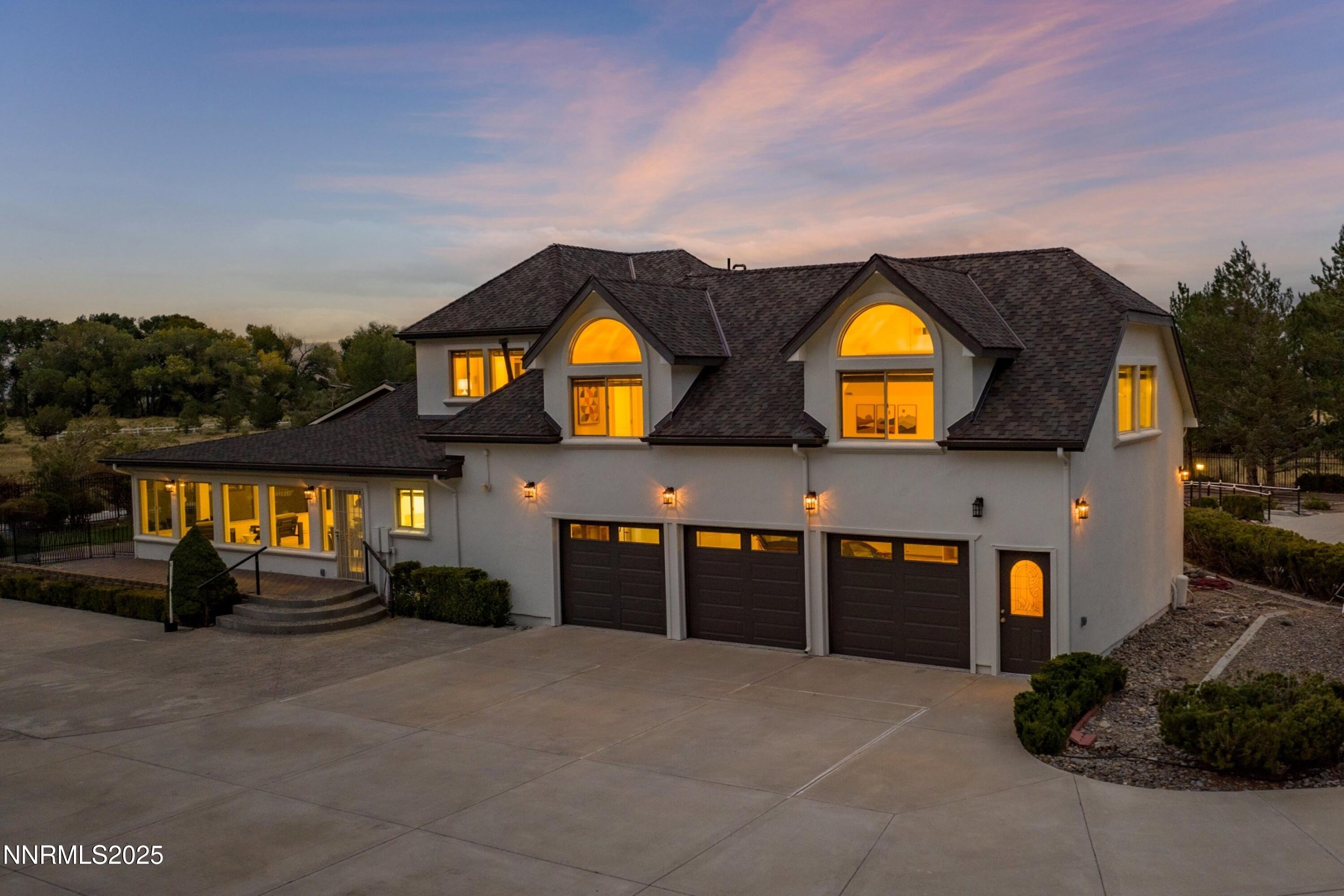 370 Genoa Lane Minden, NV 89423 - Photo 12 of 54 a front view of a house with a yard