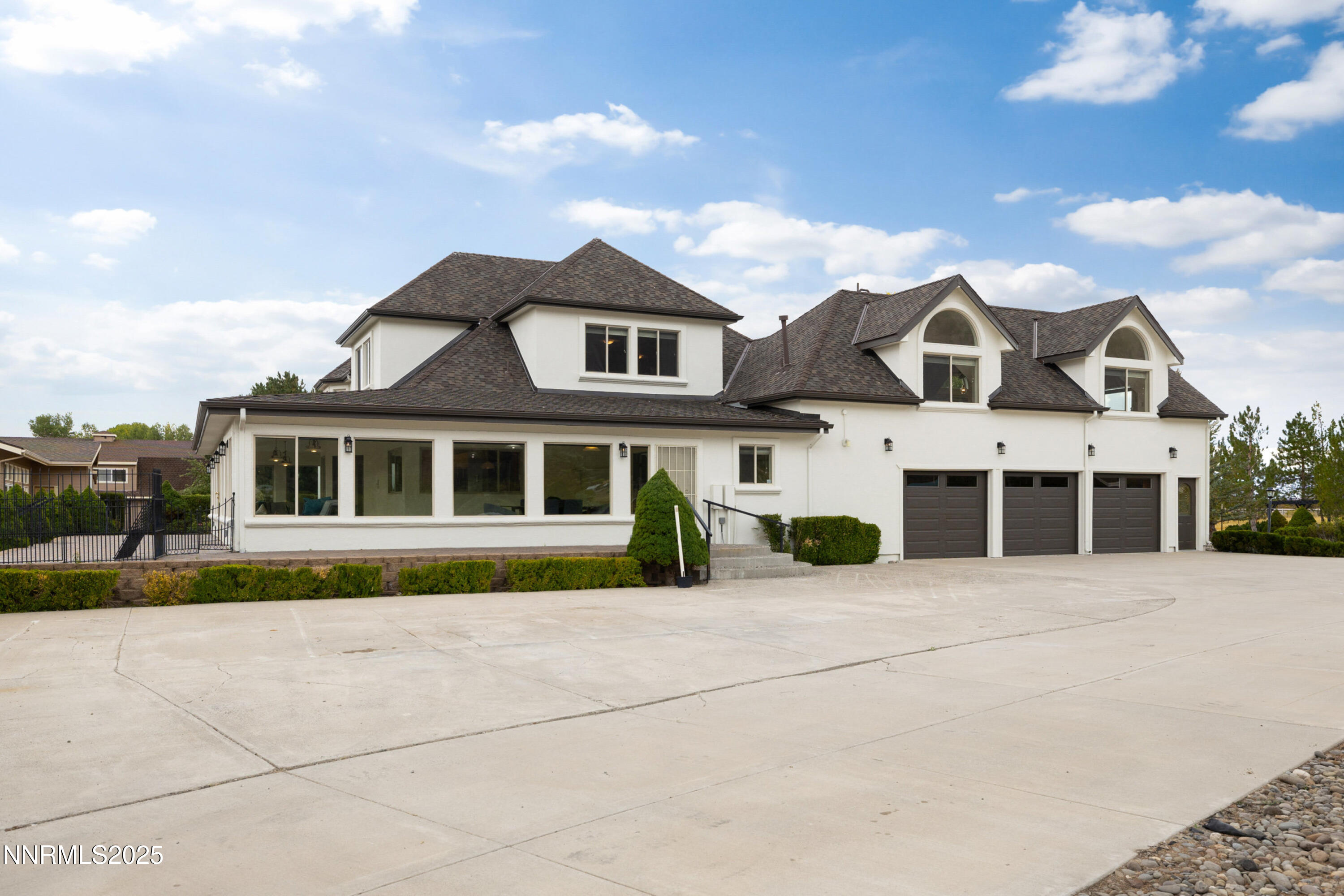 370 Genoa Lane Minden, NV 89423 - Photo 13 of 54 a front view of a house with a yard