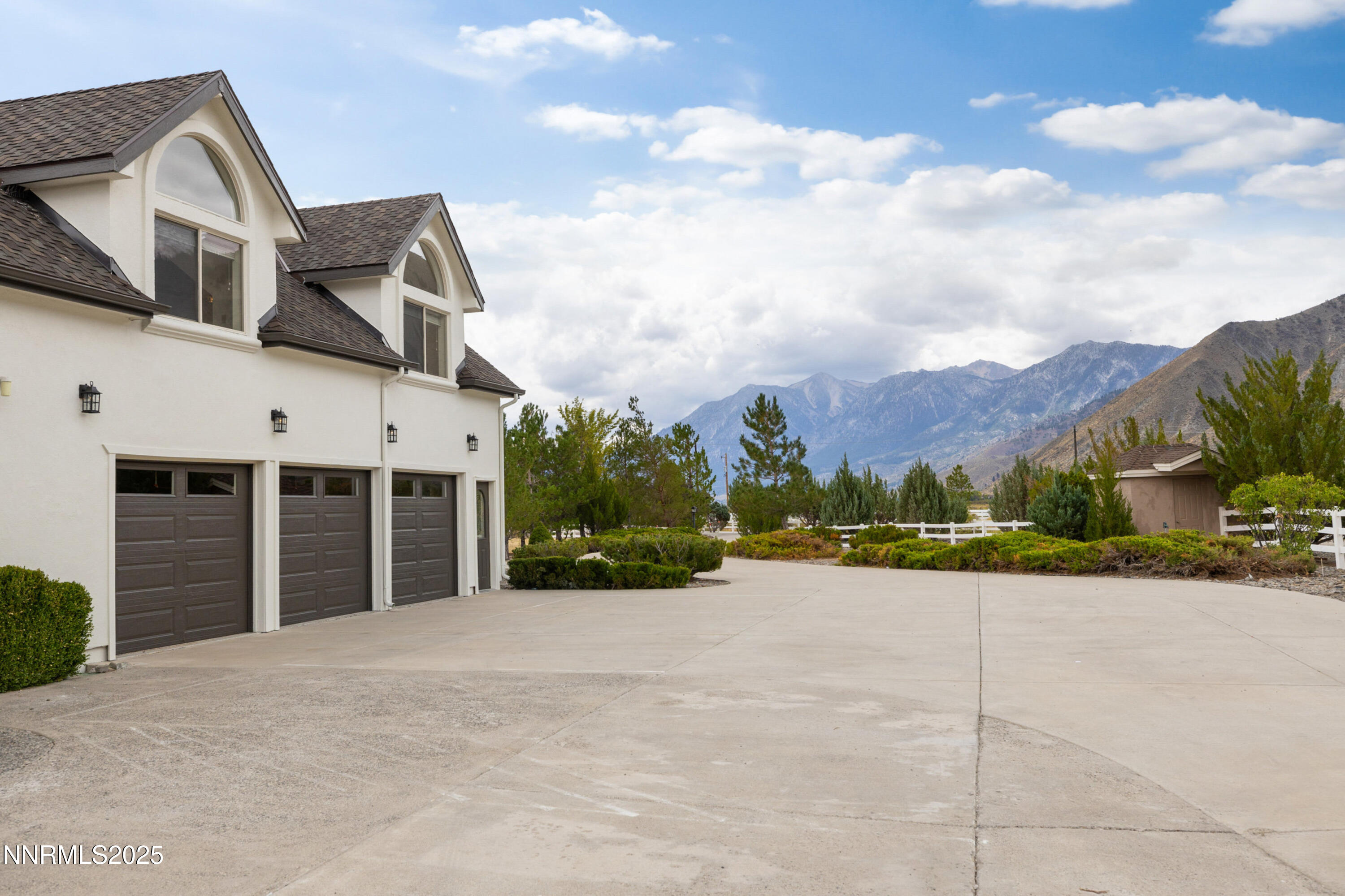 370 Genoa Lane Minden, NV 89423 - Photo 15 of 54 a view of a house with a yard and potted plants