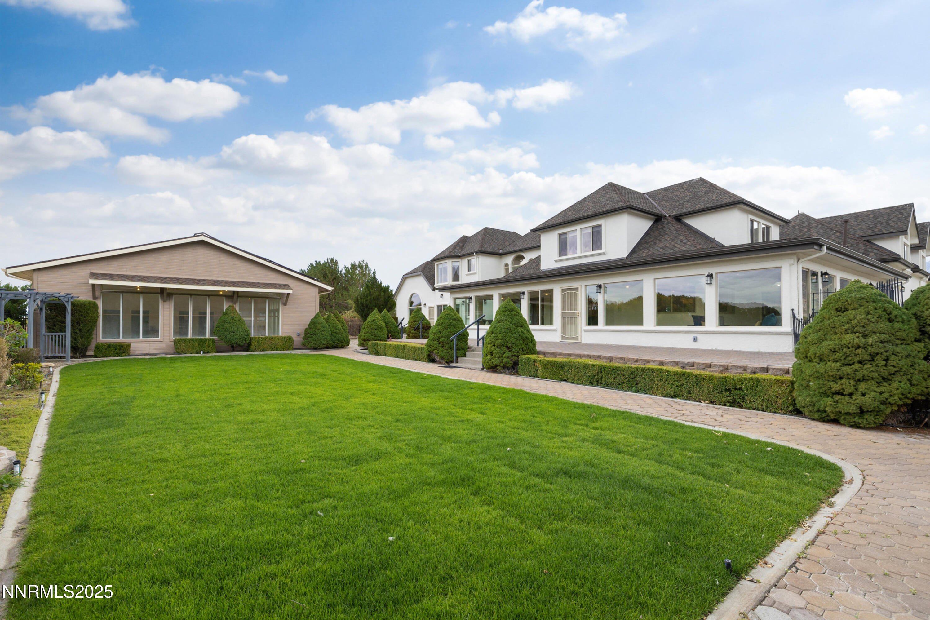 370 Genoa Lane Minden, NV 89423 - Photo 16 of 54 a front view of a house with a garden