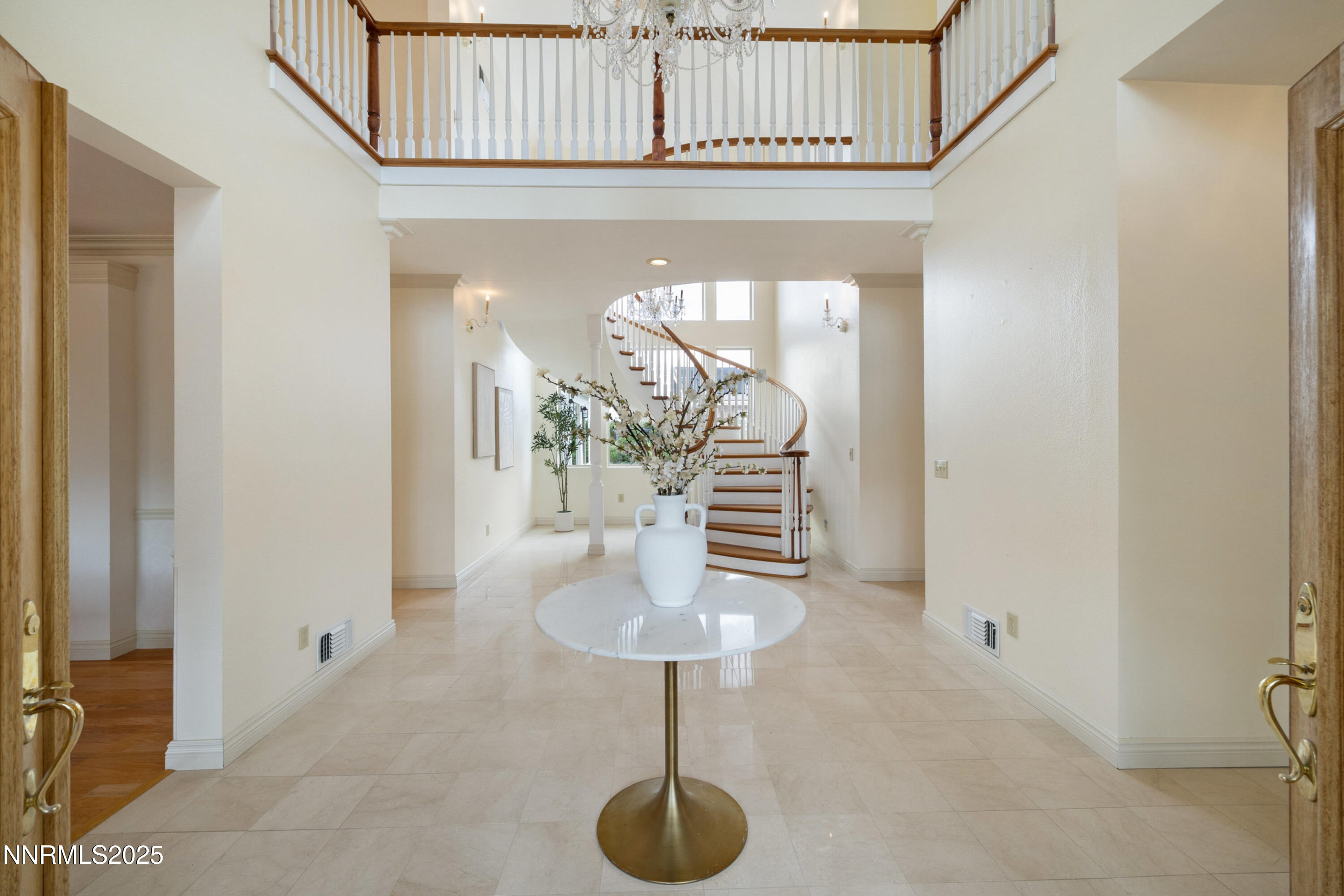 370 Genoa Lane Minden, NV 89423 - Photo 18 of 54 a view of entryway and hall with a chandelier