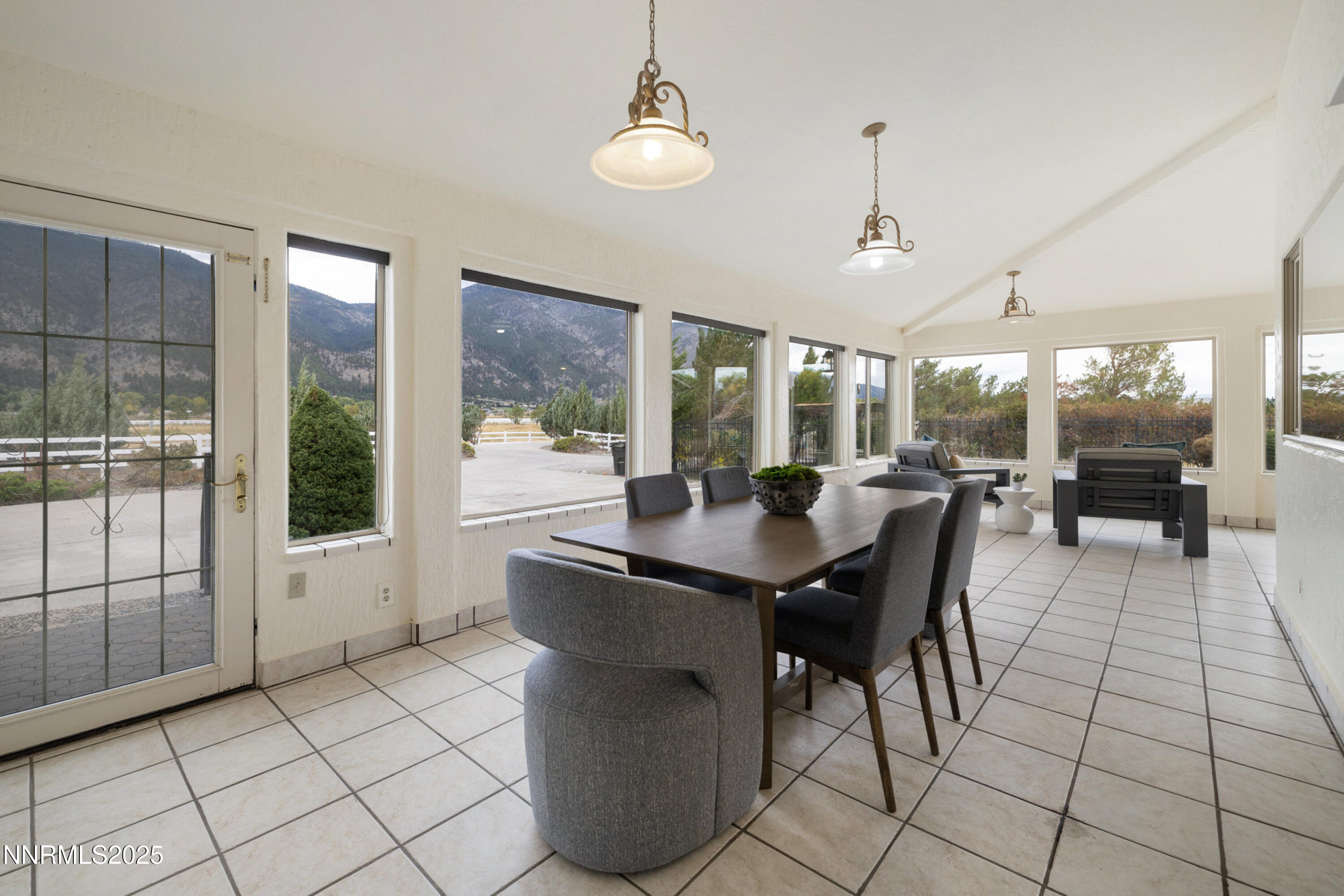 370 Genoa Lane Minden, NV 89423 - Photo 22 of 54 a view of a dining room with furniture wooden floor and chandelier