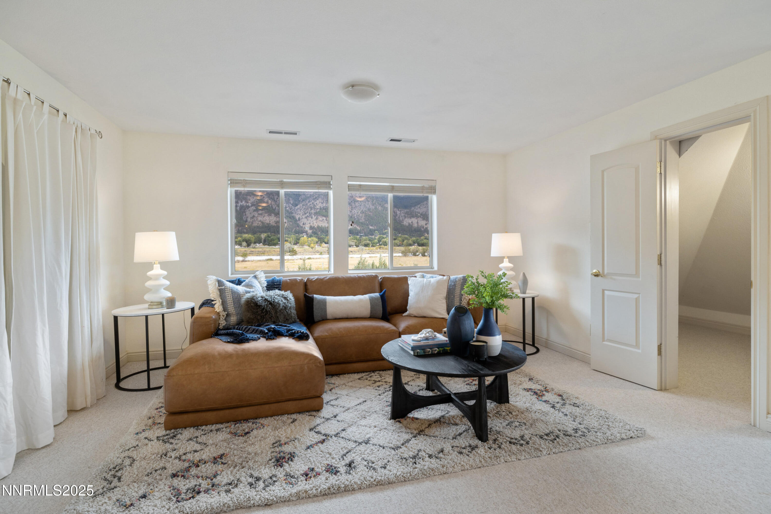 370 Genoa Lane Minden, NV 89423 - Photo 39 of 54 a living room with furniture and a large window