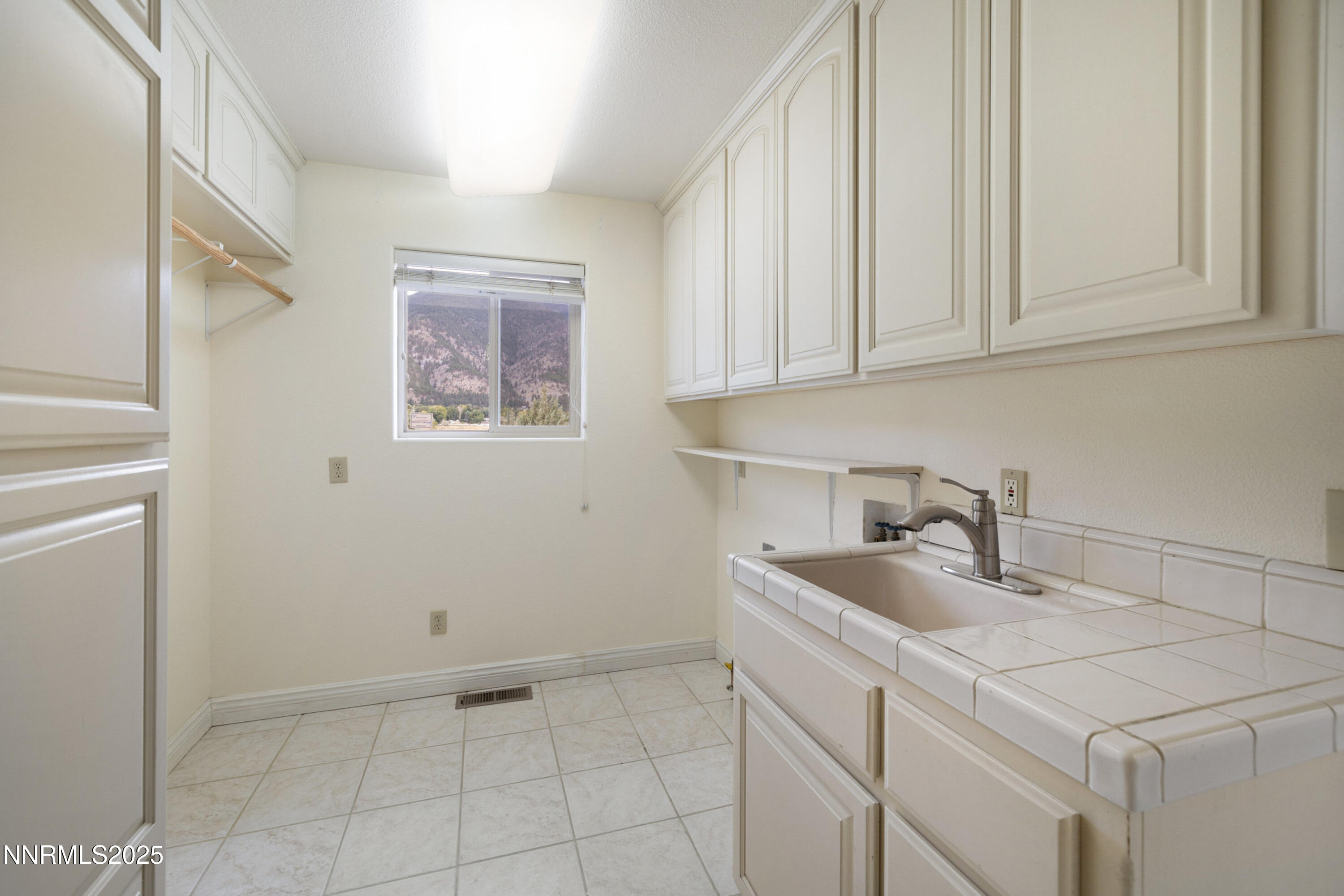 370 Genoa Lane Minden, NV 89423 - Photo 45 of 54 a kitchen with a sink cabinets and utility