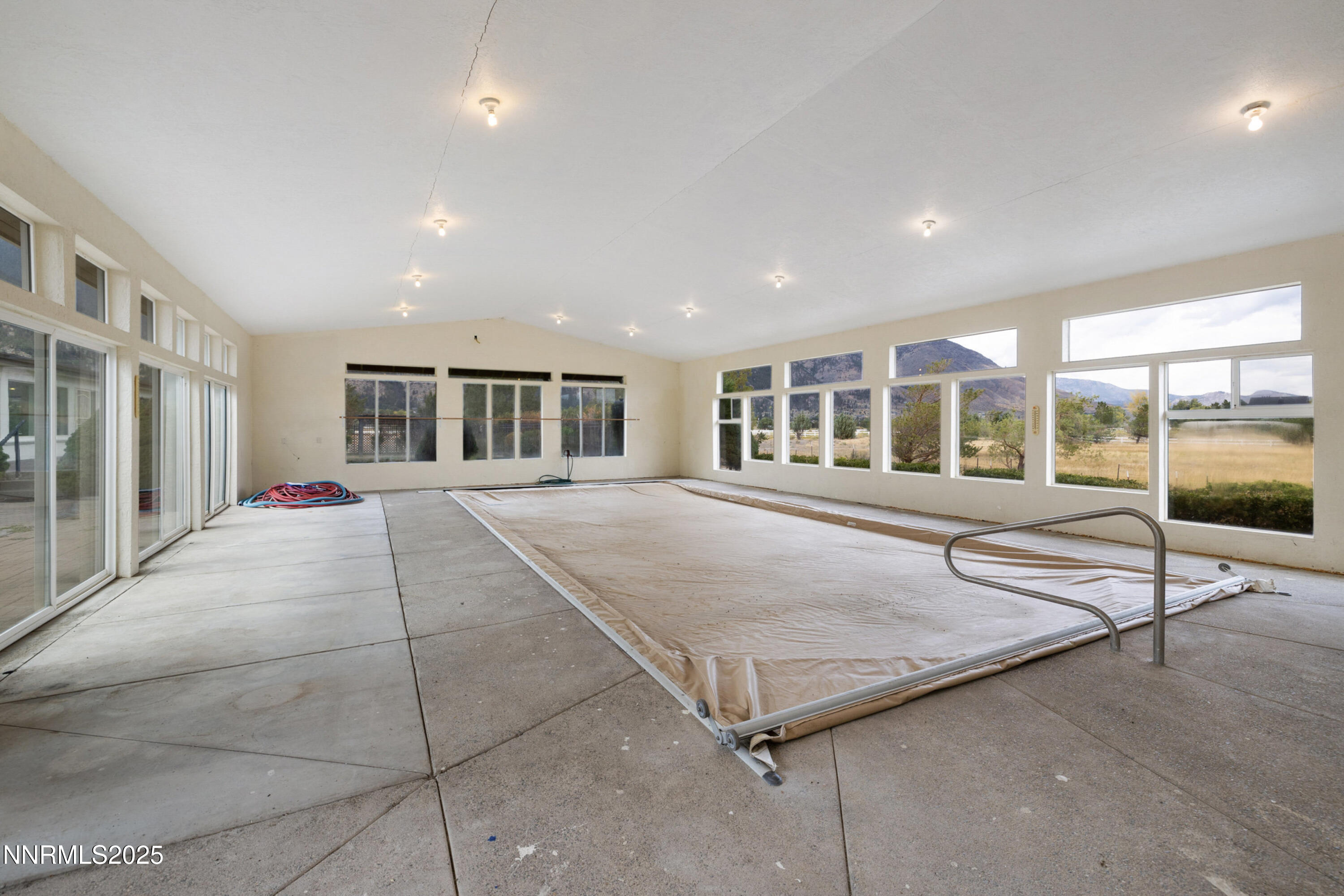 370 Genoa Lane Minden, NV 89423 - Photo 46 of 54 a room with a bed and glass door