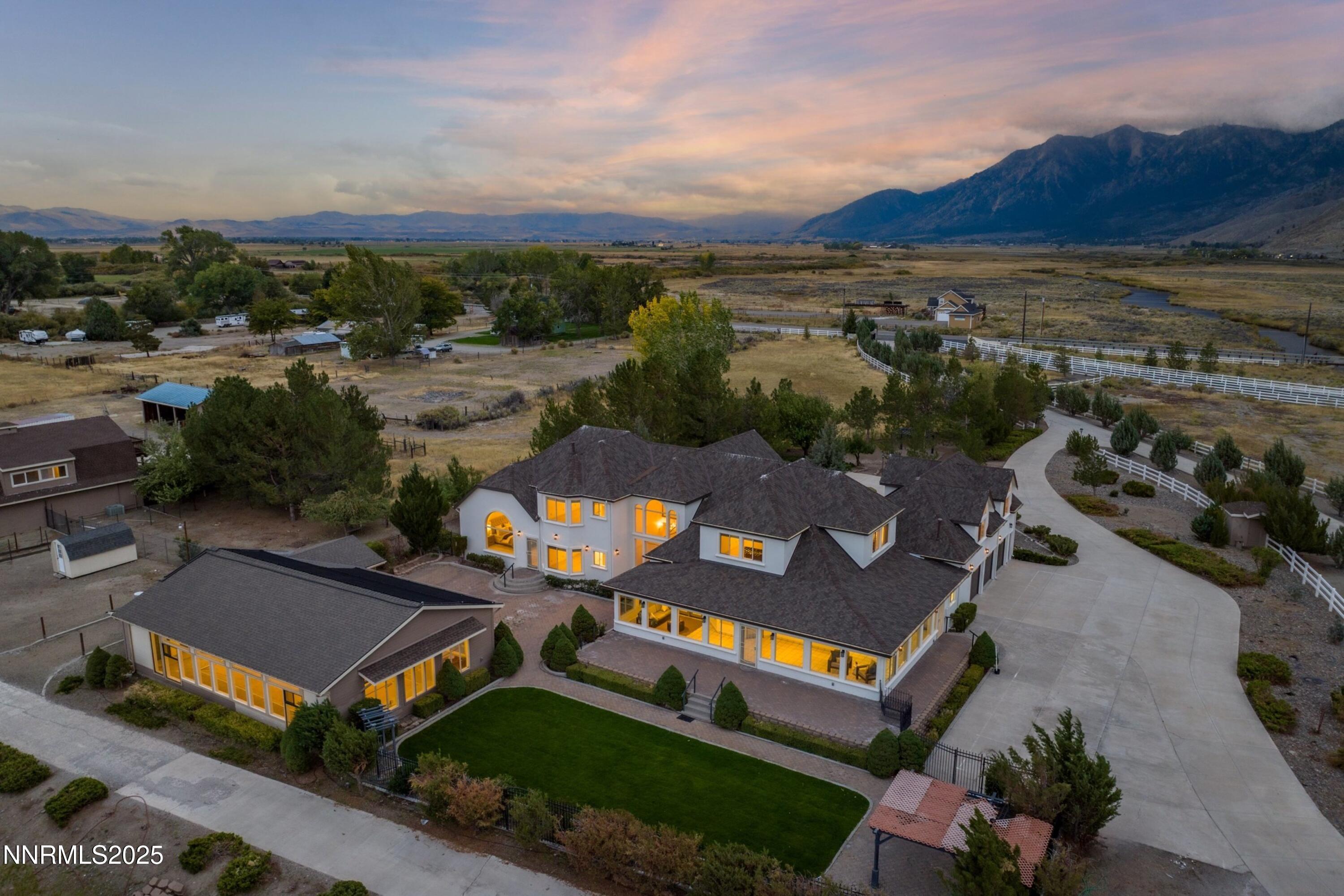 370 Genoa Lane Minden, NV 89423 - Photo 5 of 54 an aerial view of a house with a garden and mountain view in back