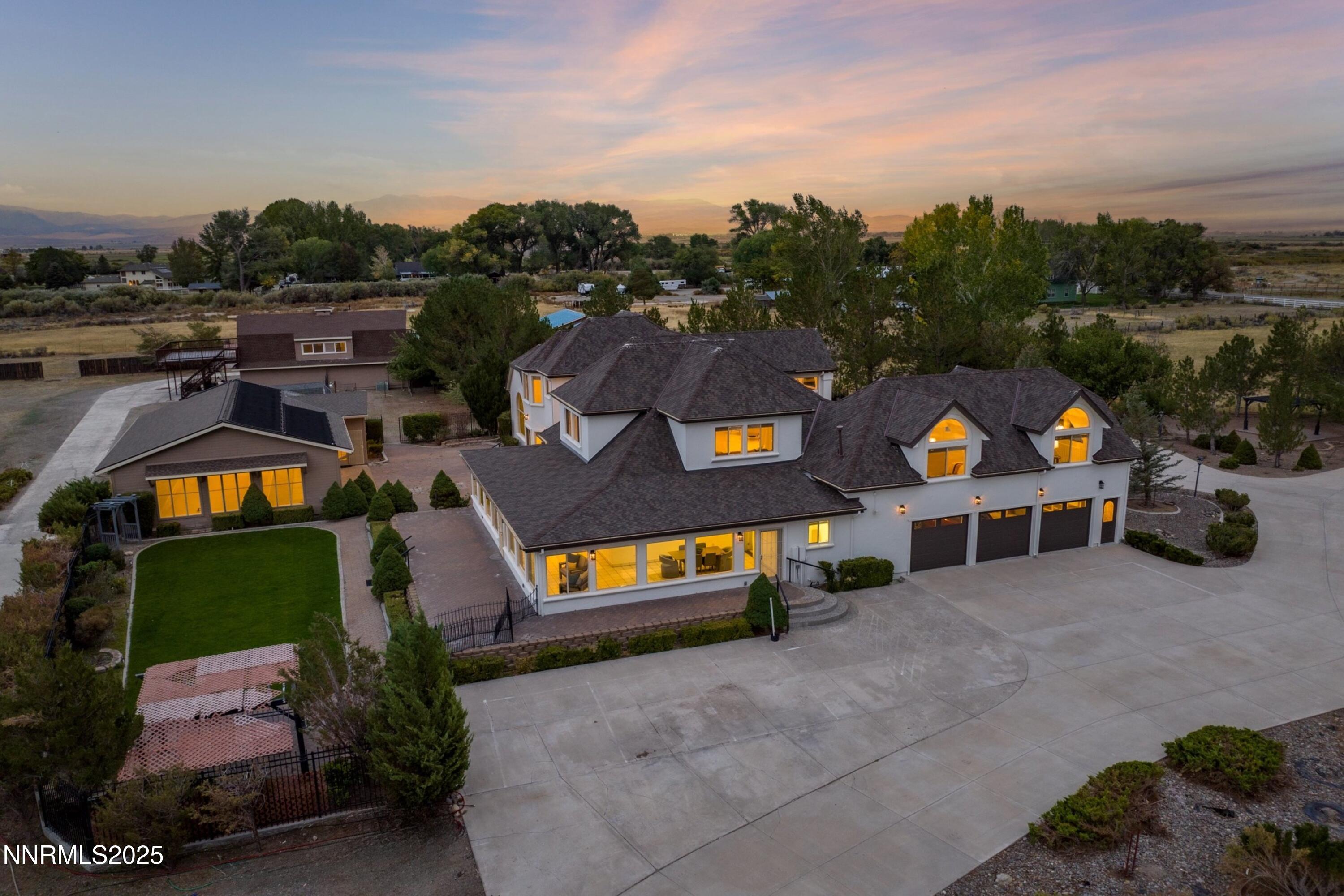 370 Genoa Lane Minden, NV 89423 - Photo 6 of 54 an aerial view of a house with a swimming pool yard and mountain view in back