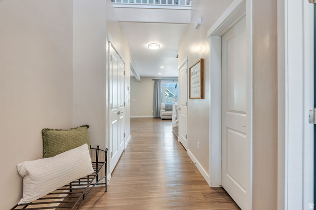 2194 Autumn Drive Mapleton, UT 84664 - Photo 10 of 41 Hallway featuring wood-finish flooring, white paneled doors, and recessed lighting