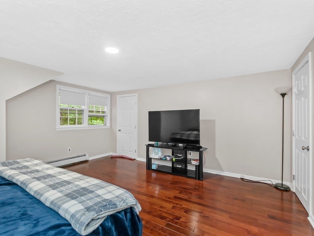 263 Cordaville Road Ashland, MA 01721 - Photo 13 of 18 a living room with furniture and a flat screen tv