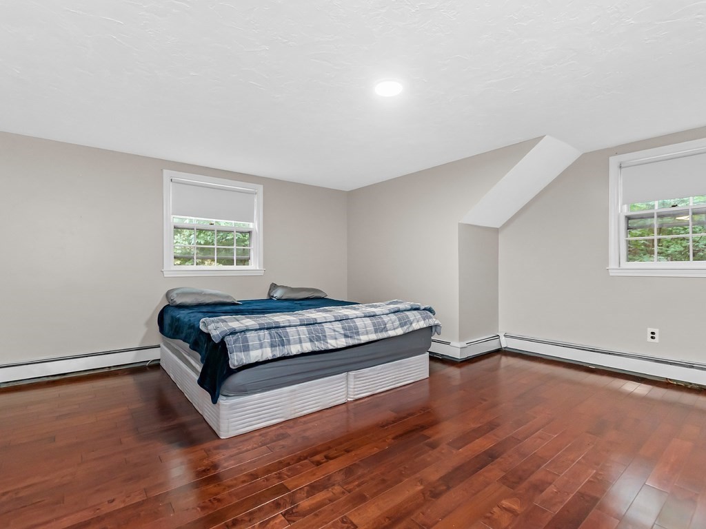 263 Cordaville Road Ashland, MA 01721 - Photo 14 of 18 a bedroom with a bed and a window