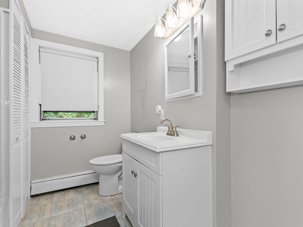 263 Cordaville Road Ashland, MA 01721 - Photo 15 of 18 a bathroom with a toilet sink and mirror