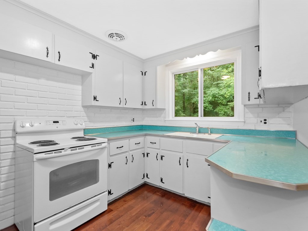 263 Cordaville Road Ashland, MA 01721 - Photo 5 of 18 a kitchen with a sink stove and cabinets