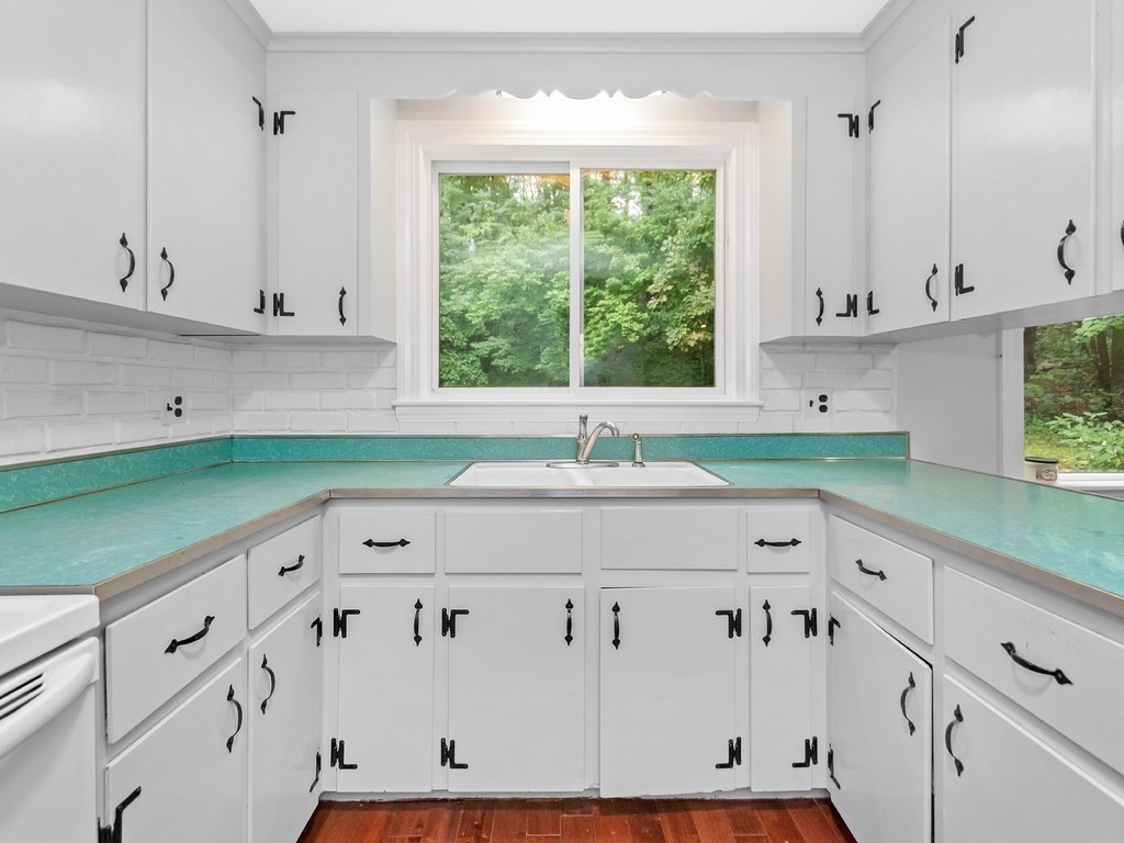 263 Cordaville Road Ashland, MA 01721 - Photo 6 of 18 a kitchen with stainless steel appliances white cabinets and a sink