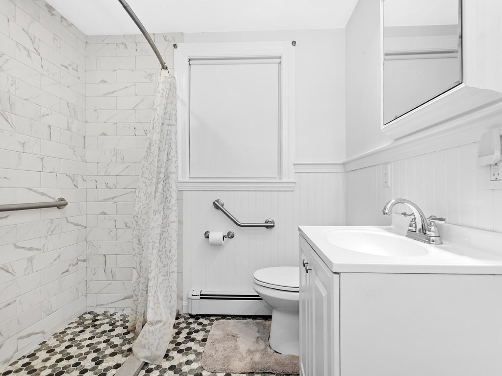 263 Cordaville Road Ashland, MA 01721 - Photo 8 of 18 a bathroom with a sink a toilet and shower