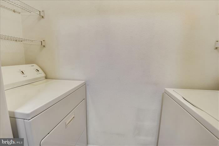 1601 Spring Gate Dr., Unit 1110 McLean, VA 22102 - Photo 24 of 26 a utility room with dryer and washer