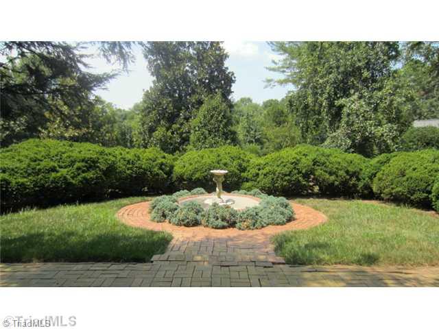 1201 Arbor Road Winston-Salem, NC 27104 - Photo 15 of 16 Yard/Garden. Fountain and wonderful old english boxwoods off rear patio courtyard