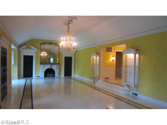 1201 Arbor Road Winston-Salem, NC 27104 - Photo 4 of 16 Living Room. Sunken living room with carved marble fireplaces at either end, double bay windows and entrance to courtyard and back lawn