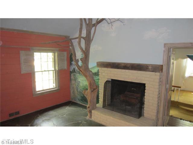1201 Arbor Road Winston-Salem, NC 27104 - Photo 6 of 16 Den/Family/Great Room. Den has stone floors, built-in bookcases and wonderful mural